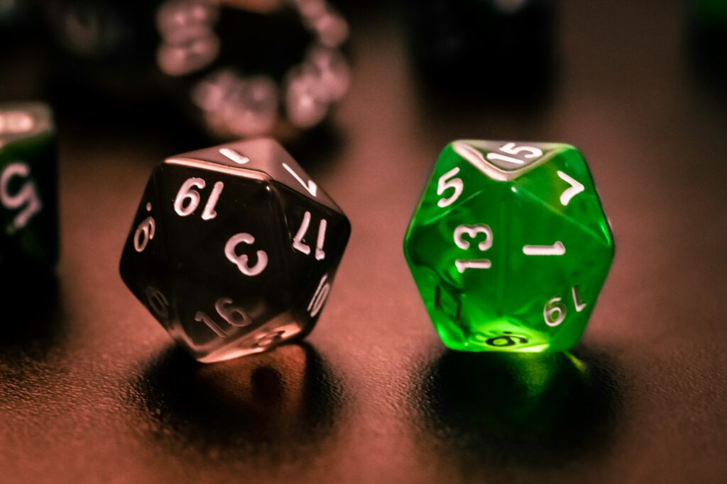 green and black dice on brown wooden table